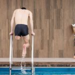Training - Man Getting Out of Swimming Pool