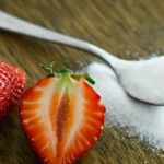 Sugar - Strawberry Beside Spoon of Sugar