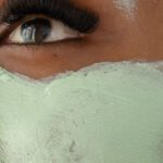 Wellness Routine - Anonymous black woman with clay mask