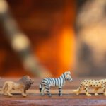 Play - Plastic Animal Toys on Wooden Surface