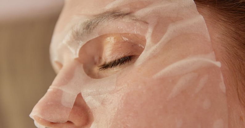 Anti-Aging Treatments - A Close-up Shot of a Woman with a Sheet Mask on Face
